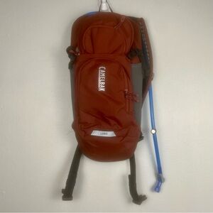NEW CamelBak Lobo 9 Bike Hydration Backpack 70 Oz Burnt Orange Hiking Outdoors